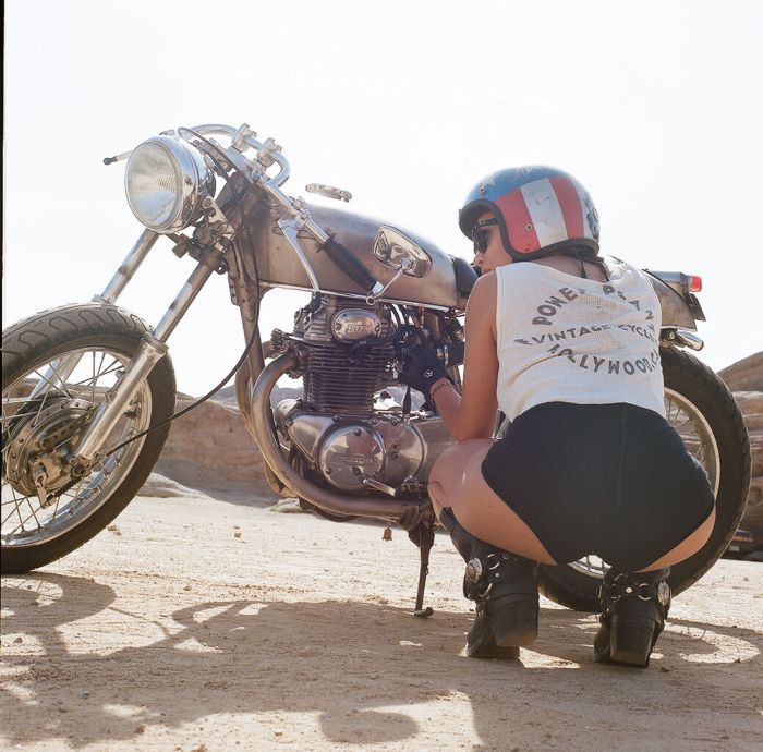 A playful frame from Girls on a motorcycle — online in Manila